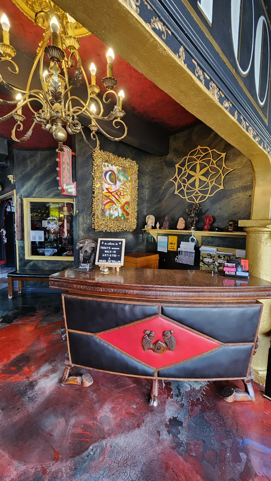 Strata Tattoo Lab reception desk and chandelier