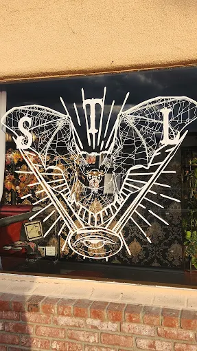 Custom white artwork on the front studio window