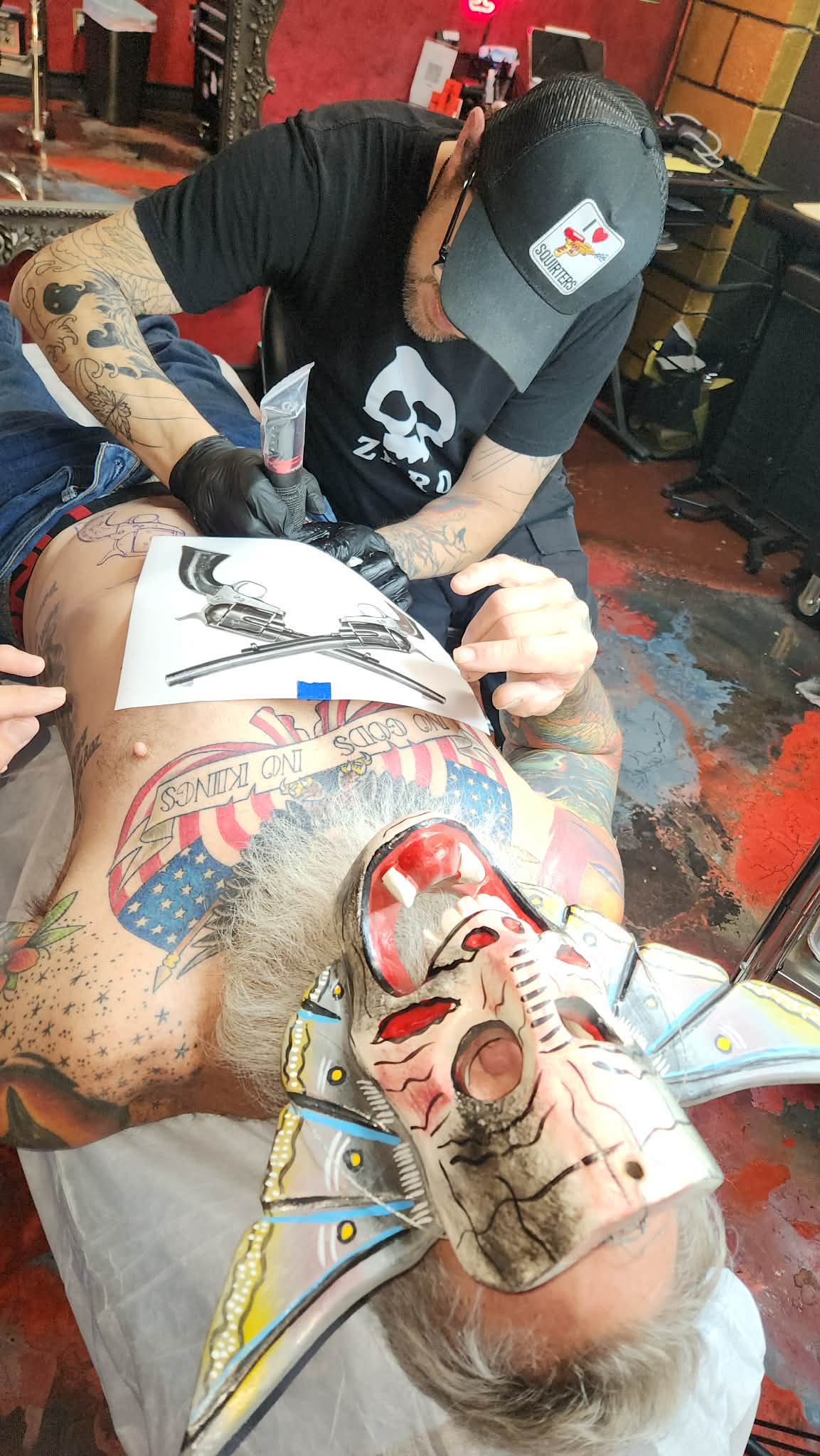 Tattoo session in progress inside Strata Tattoo Lab